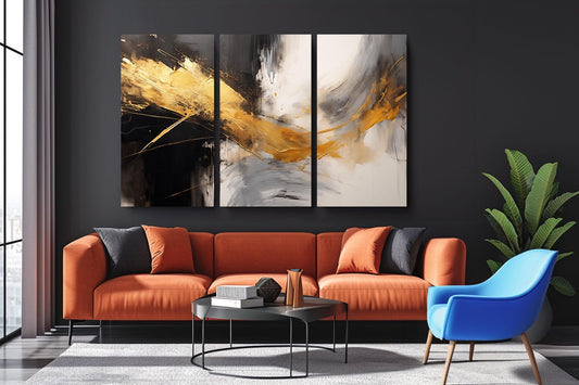 a living room with a couch and two paintings on the wall