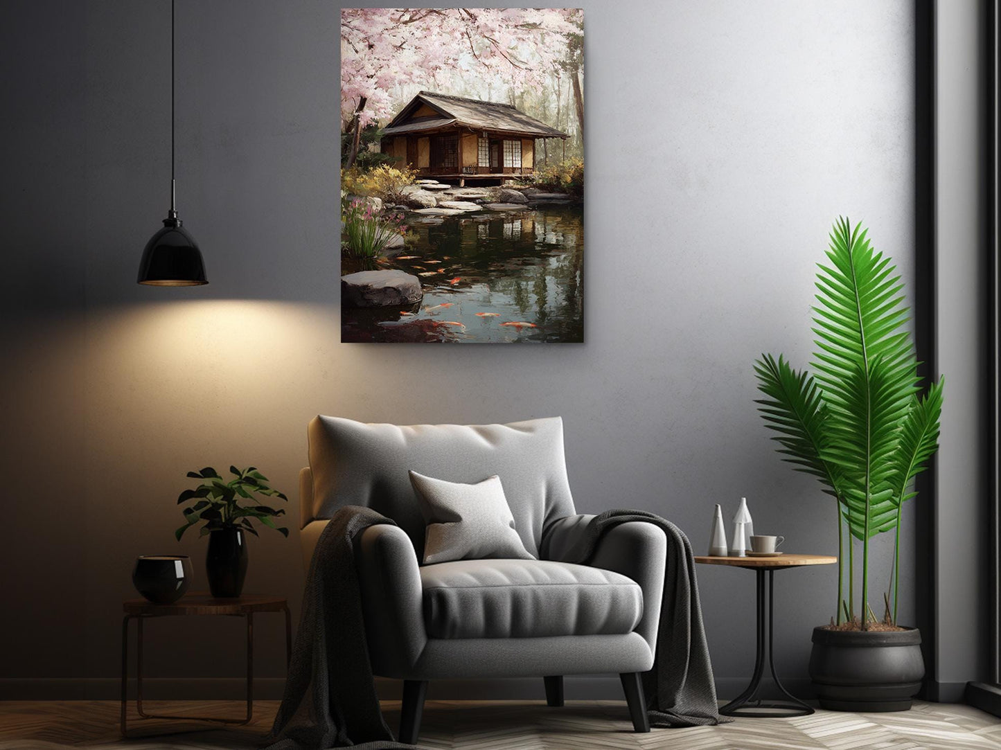 a serene living room with a cozy gray armchair, a wooden side table, and a potted plant. Above the armchair, there is a framed painting of a tranquil Japanese garden with a small wooden house and a pond.