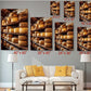 The image is a wall art display featuring multiple photographs of cheese wheels, each with a different size and orientation. The photographs are arranged in a grid-like pattern, with each photograph having a corresponding size and orientation label. The wall art is set against a gray wall, and there is a white couch and a coffee table in the foreground.
