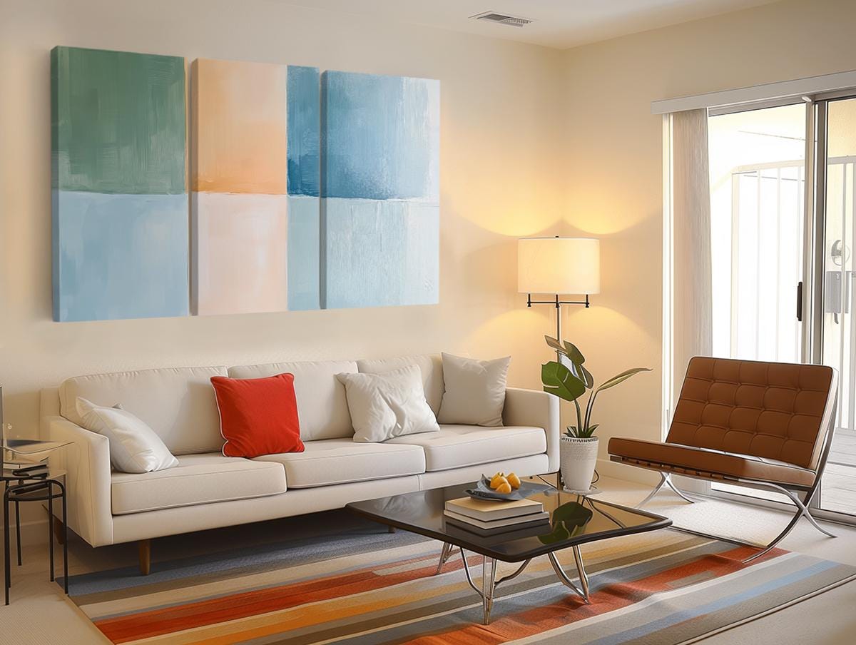 a living room filled with furniture and a painting on the wall