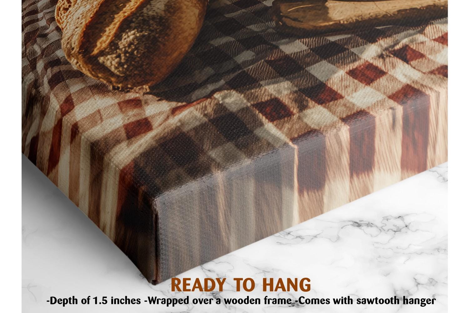 The image is a close-up of a wooden frame with a checkered cloth draped over it, and there is a loaf of bread on top of the frame. The text below the image states that it is a ready-to-hang piece of art, with a depth of 1.5 inches and a wooden frame.