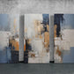 three abstract paintings on a concrete wall