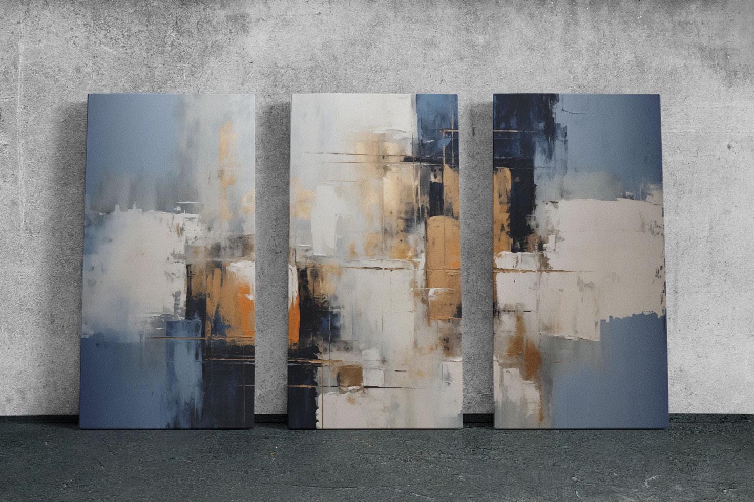 three abstract paintings on a concrete wall
