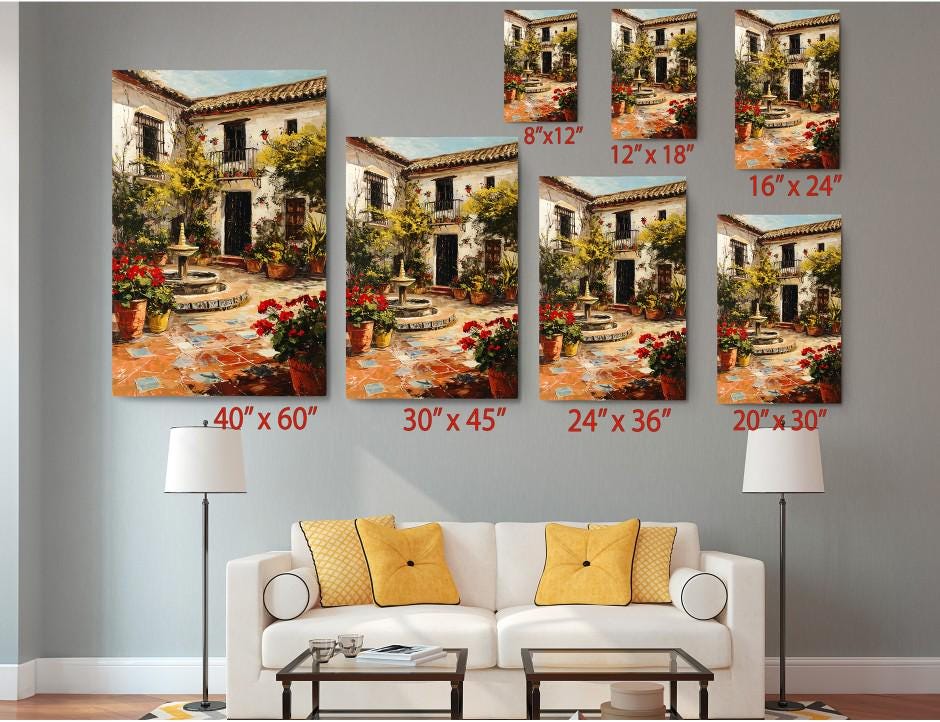 The image is a living room with a white sofa and a coffee table. Above the sofa, there are six framed paintings of a Spanish-style house, each with a different size and resolution. The paintings are arranged in a grid-like pattern on the wall, with each one depicting a different aspect of the house and its surroundings.