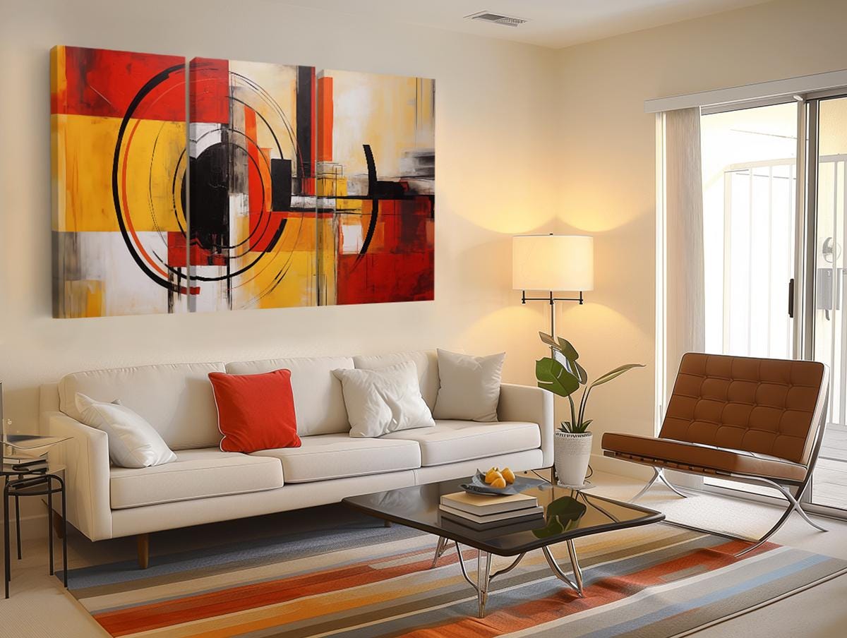 a living room filled with furniture and a painting on the wall