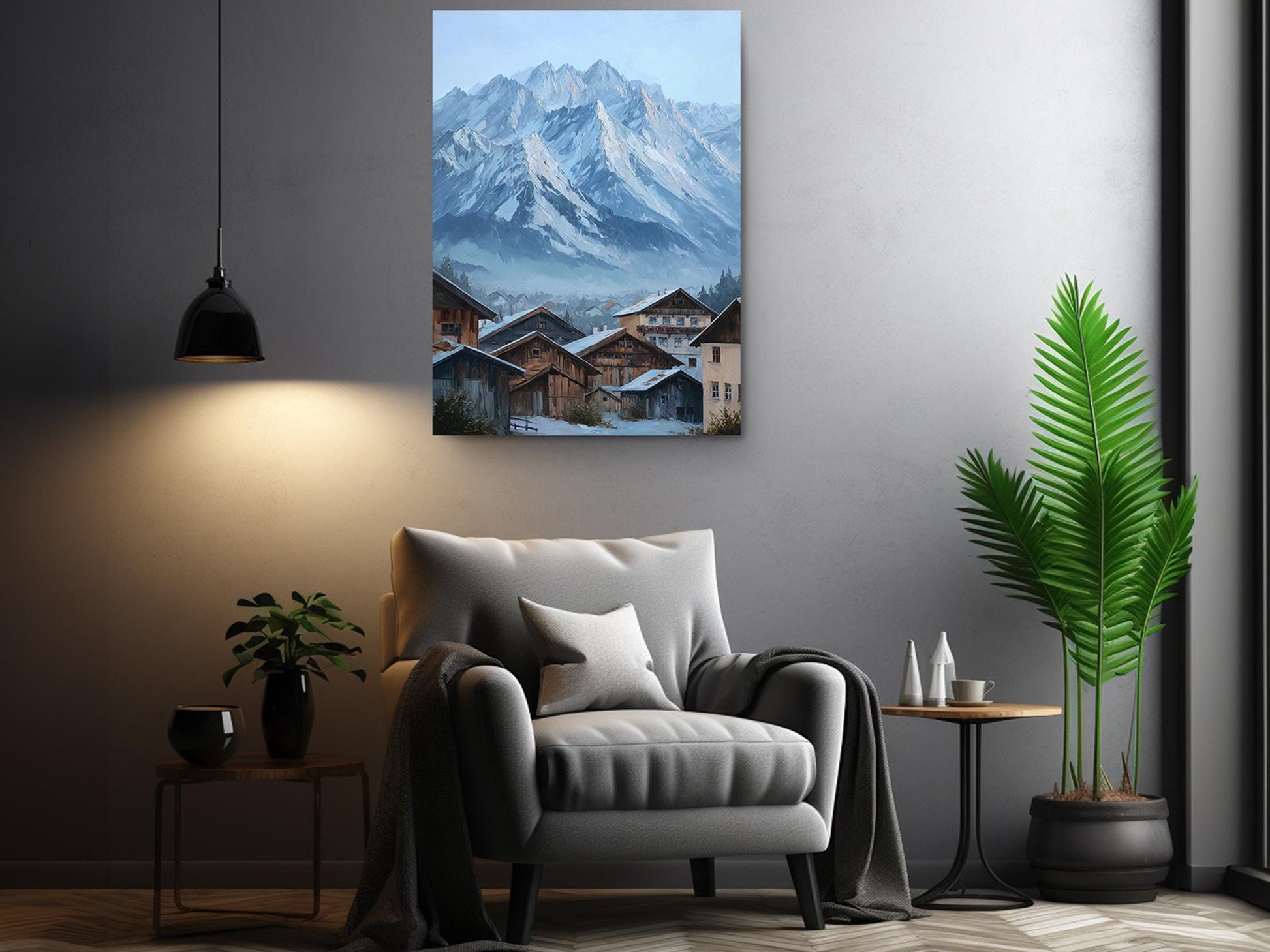 a cozy living room with a comfortable gray armchair, a wooden side table, and a potted plant. Above the armchair, there is a large painting of a snowy mountain village, creating a serene and picturesque atmosphere in the room.