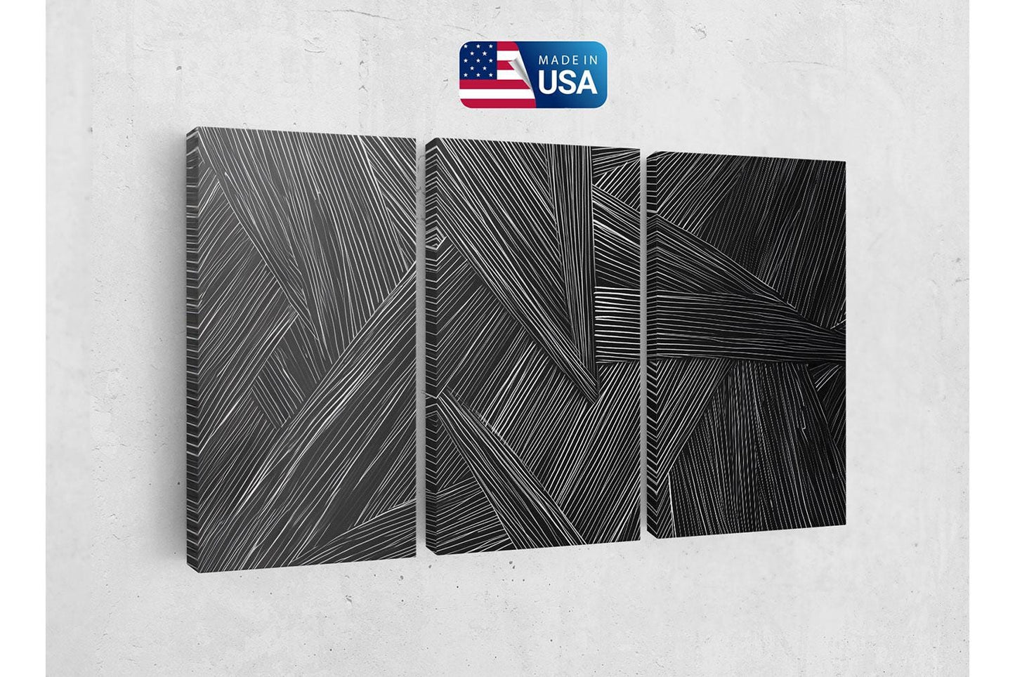 a set of three black and white paintings on a wall