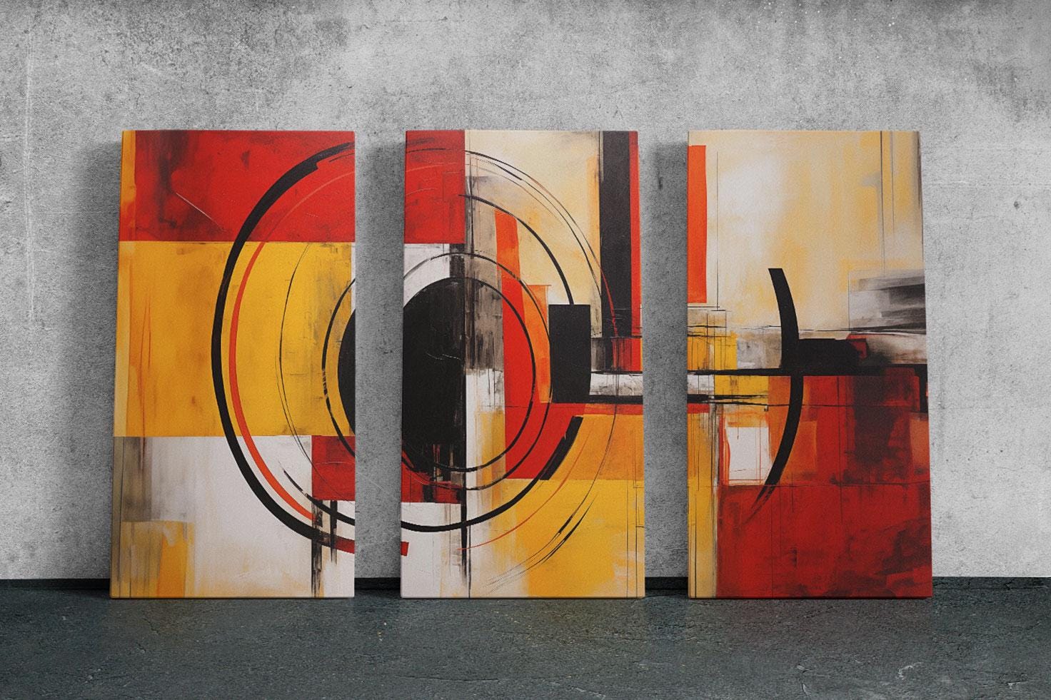 three abstract paintings on a wall in a room