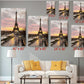 The image is a living room with a white sofa and a coffee table. Above the sofa, there are six framed pictures of the Eiffel Tower, each with a different size and resolution, ranging from 8 x 12 to 24 x 36 inches. The pictures are arranged in a grid-like pattern on the wall, creating a visually appealing display.