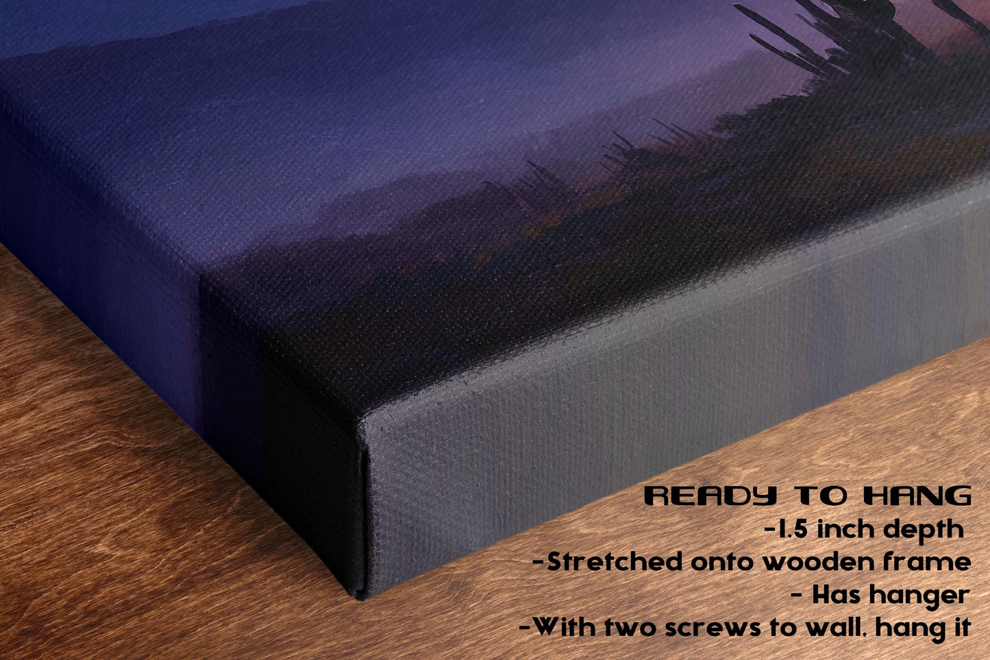 The image is a close-up of a canvas print featuring a desert landscape with mountains in the background. The print is hanging on a wooden surface, and there is text below the print that provides information about the print size, frame, and hanging method.