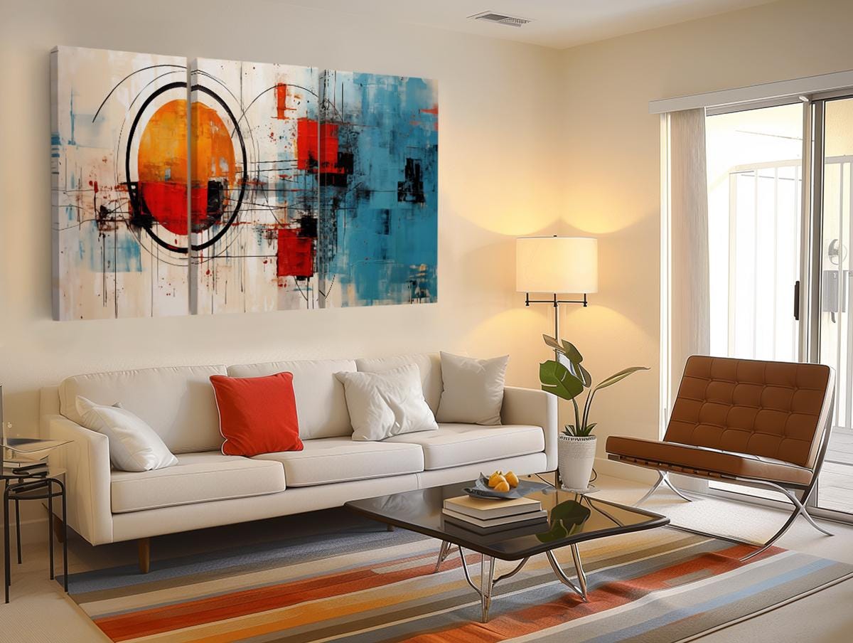 a living room filled with furniture and a painting on the wall