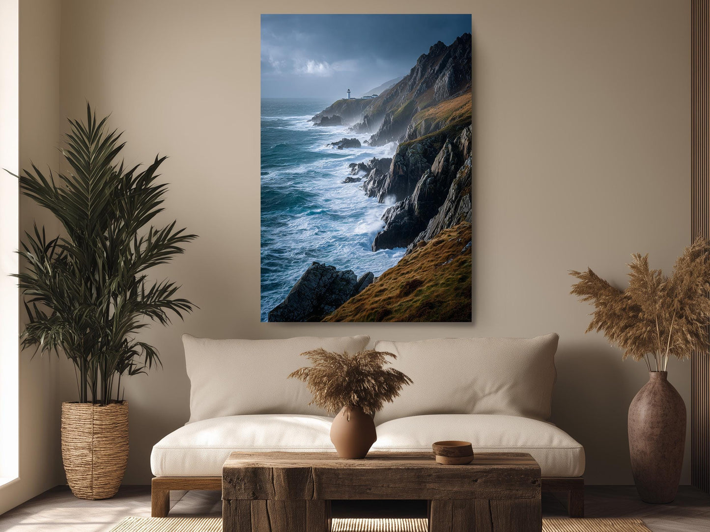 a serene living room with a large painting of a cliff overlooking the ocean hanging on the wall. The painting captures the rugged beauty of the rocky coastline and the vast expanse of the sea. The room is decorated with a comfortable sofa, a wooden coffee table, and two potted plants, creating a cozy and inviting atmosphere.