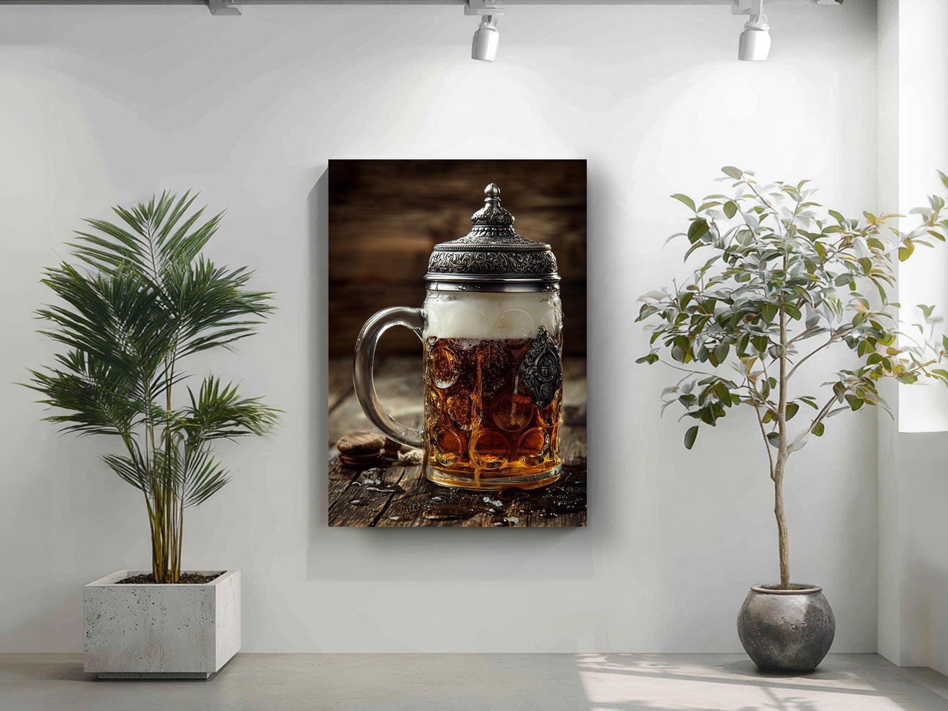 a framed photograph of a glass mug filled with beer, placed on a wooden surface, with a potted plant to the left and a plant to the right.