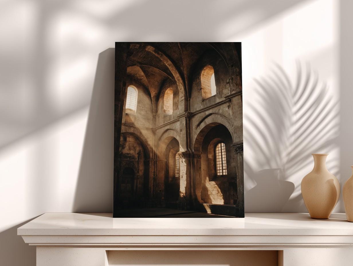 a large, dark-colored photograph of an old, historic building with arched windows and stone walls, displayed on a white shelf.