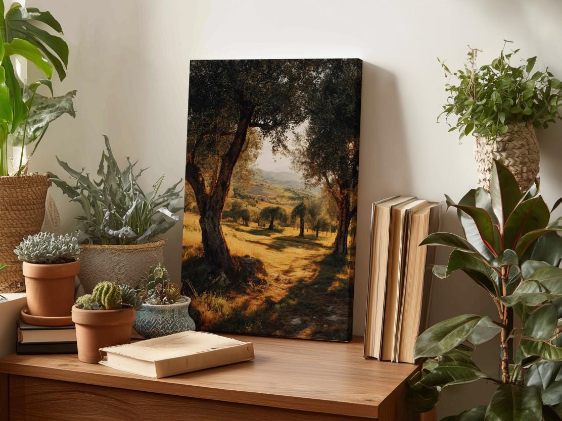 a wooden desk with a painting of a scenic landscape, surrounded by various potted plants and books.
