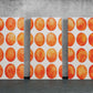 three paintings of orange circles on a white wall