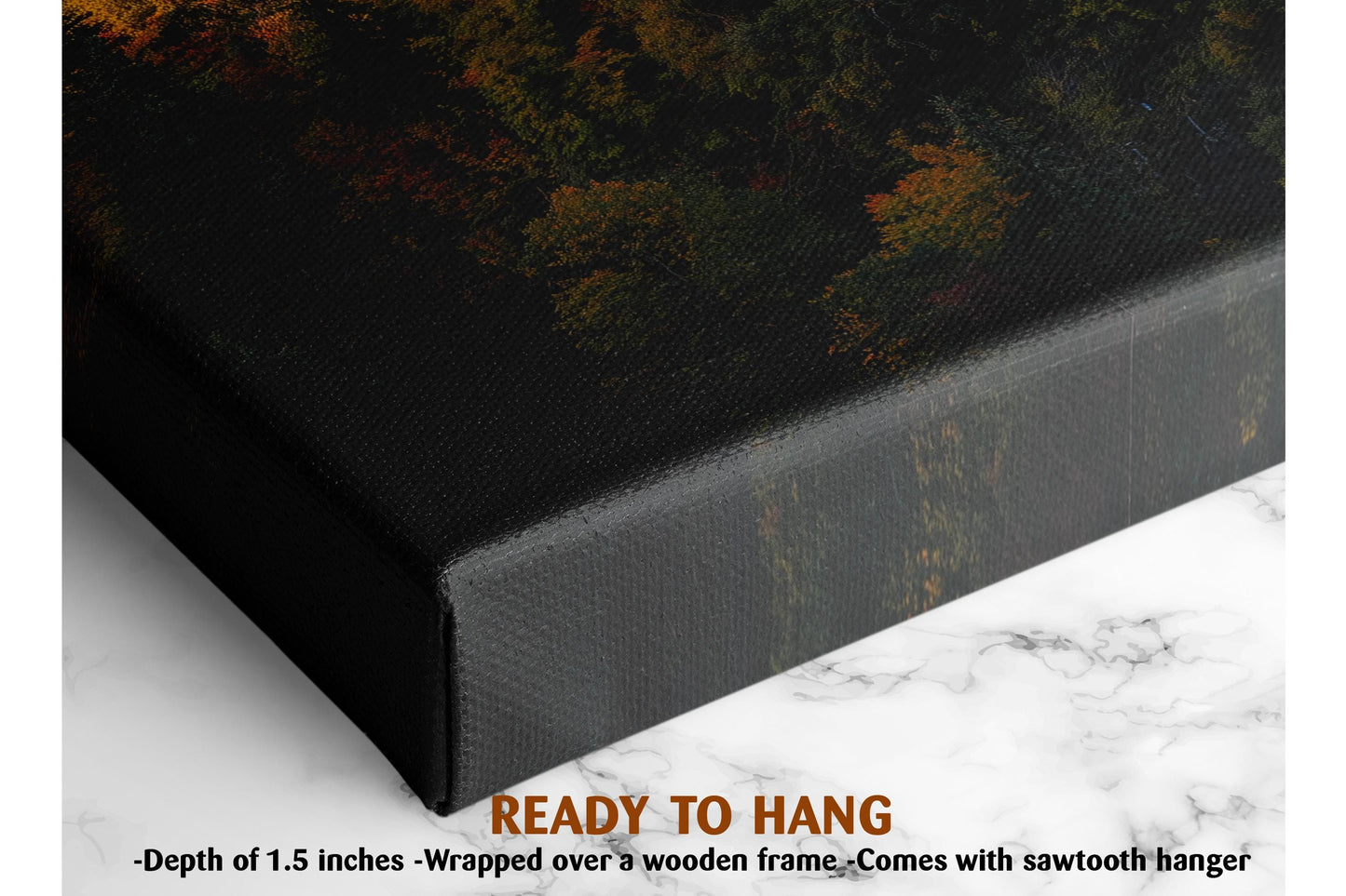 The image is a close-up of a black canvas print featuring a forest scene with trees and foliage. The print is wrapped over a wooden frame and hangs on a marble surface.