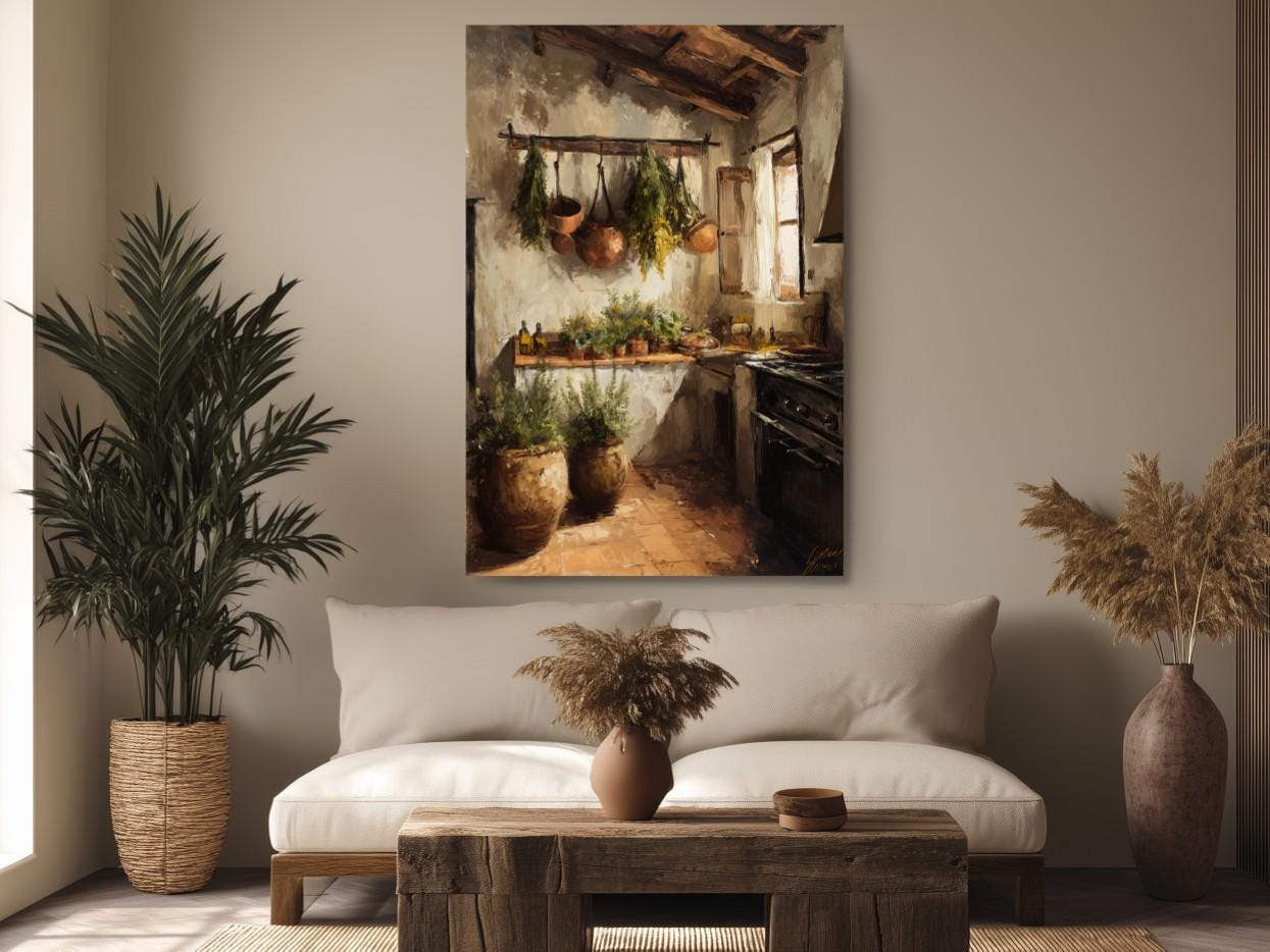 a cozy kitchen scene with a large painting hanging on the wall above a wooden coffee table. The painting features a rustic kitchen with hanging pots and pans, as well as a window providing natural light. The kitchen is complemented by potted plants and a vase on the coffee table, creating a warm and inviting atmosphere.
