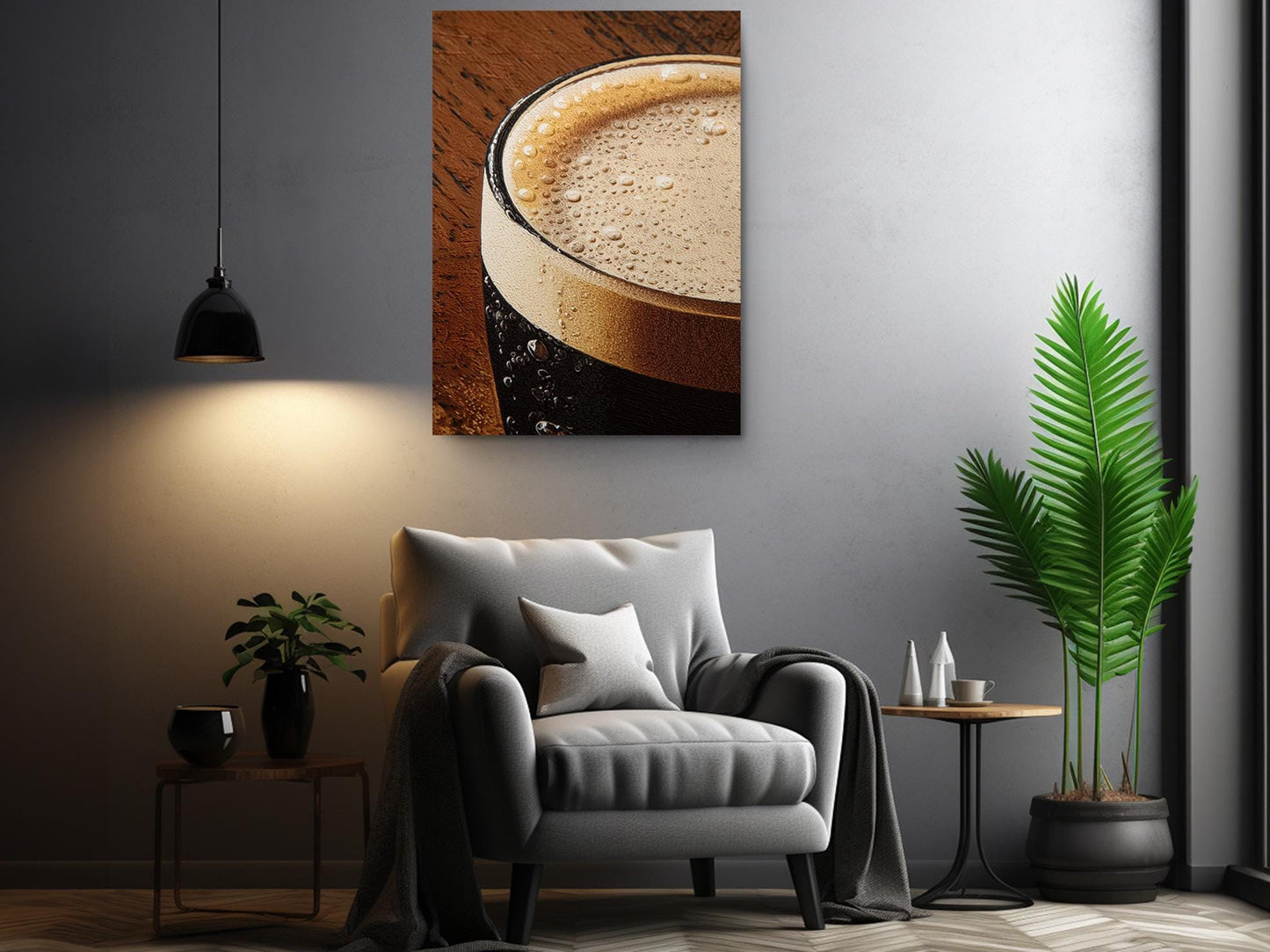 a cozy living room with a comfortable gray armchair, a wooden side table, and a potted plant. Above the armchair, there is a framed photograph of a glass of beer with a frothy head, creating a warm and inviting atmosphere.