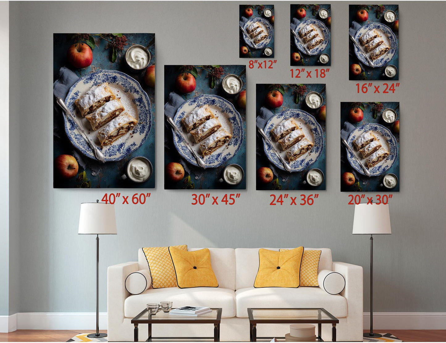 The image is a living room with a white sofa and a coffee table. Above the sofa, there are six framed images of a dessert, including a cake and apples, displayed in various sizes. The images are arranged in a grid-like pattern on the wall, with each frame having a different size and orientation.