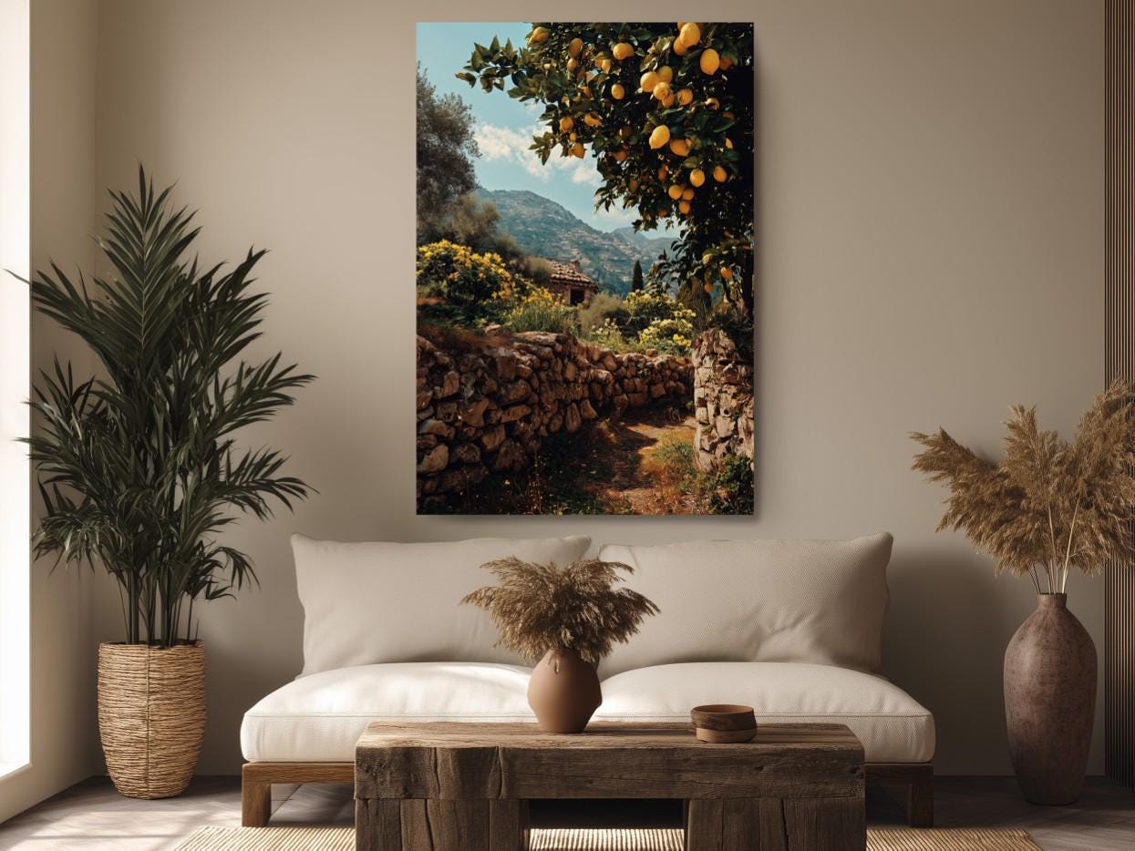 a serene and inviting living room with a large painting of a stone path leading through a lush garden, surrounded by orange trees and a stone wall. The room is decorated with potted plants, a wooden coffee table, and a comfortable sofa, creating a cozy and relaxing atmosphere.