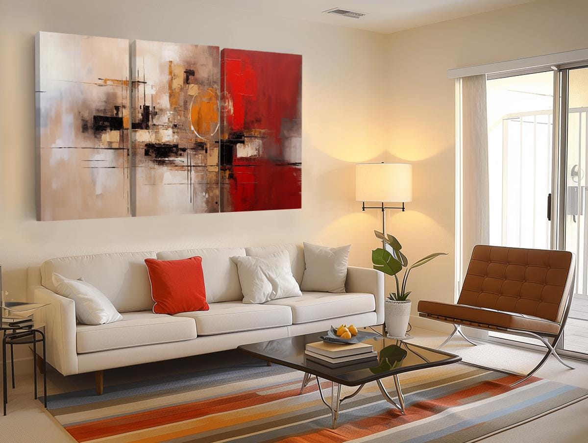 a living room filled with furniture and a painting on the wall
