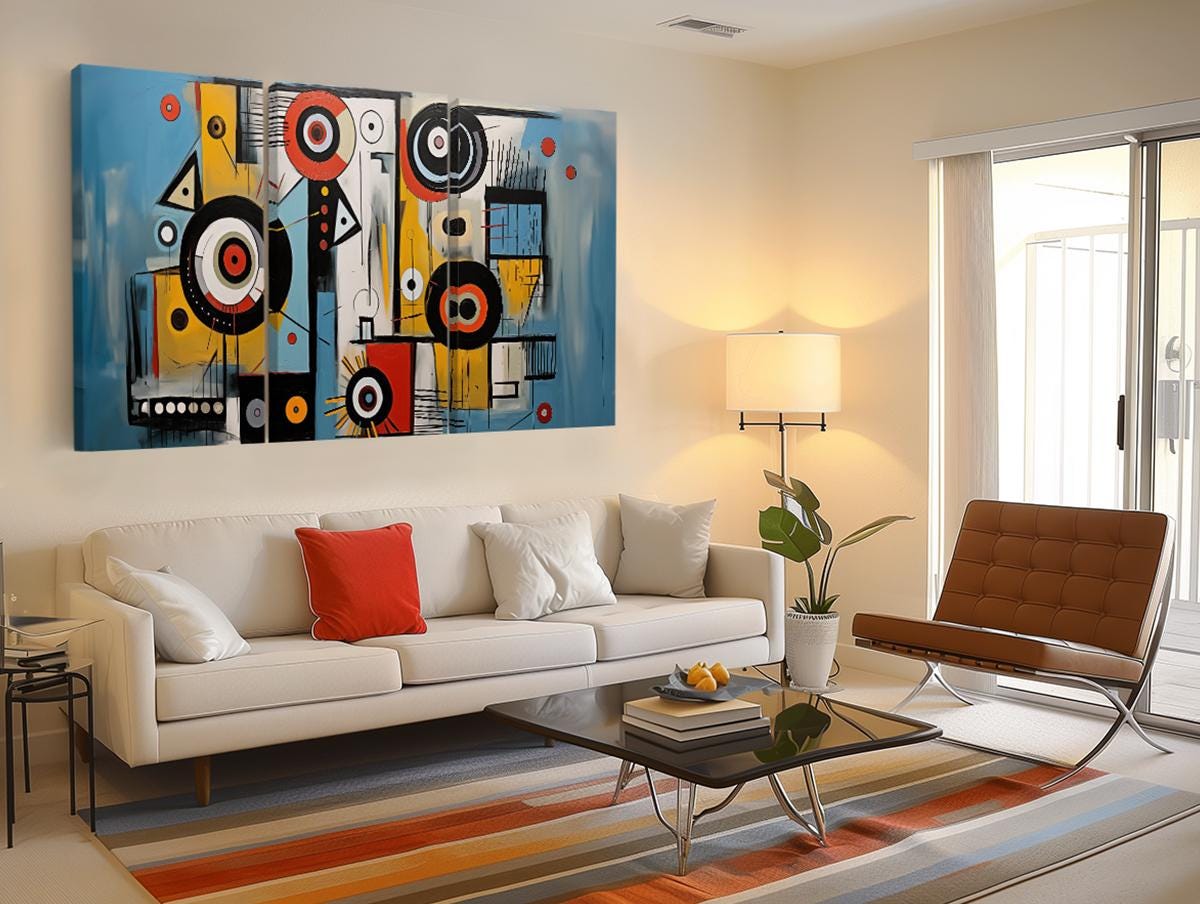 a living room filled with furniture and a painting on the wall