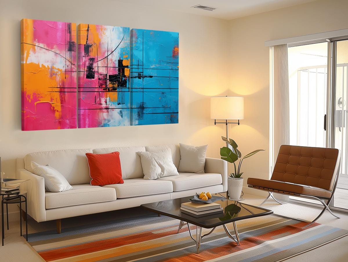 a living room filled with furniture and a painting on the wall