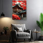 a modern living room with a gray armchair, a potted plant, and a framed picture of a traditional Japanese temple with red autumn foliage.