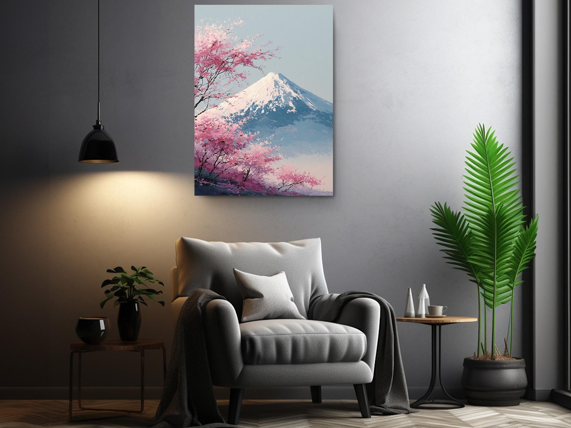 a serene living room with a gray armchair, a potted plant, and a framed picture of a mountain with pink blossoms hanging on the wall.